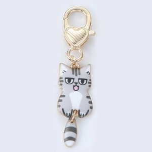 Detail of cute grey tabby cat keychain with heart-shaped lobster clasp and moving tail