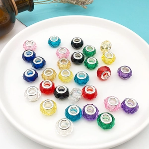 Macro shot of 13mm faceted resin beads in various colors for DIY jewelry making