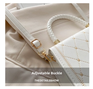 Detail showing the adjustable golden buckle on a white quilted crossbody bag strap