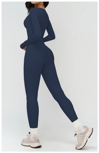 Detail view of seamless dark blue yoga set with high-waist leggings and long sleeve top