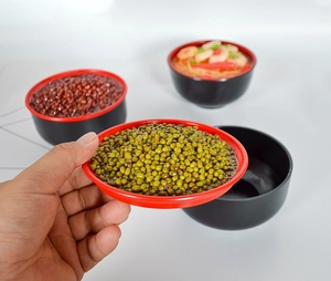Detail of red and black dual-color food model bowl for photography props and storage