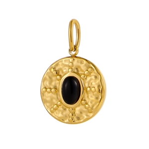 Macro shot of vintage round gold pendant with hammered texture and black gemstone
