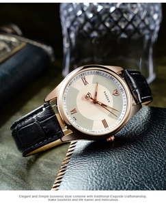 Detail of rose gold business watch with white dial and black crocodile leather strap