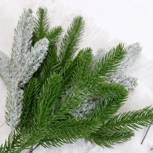 Artificial Christmas pine needle branches with snowy tips for DIY floral holiday decor