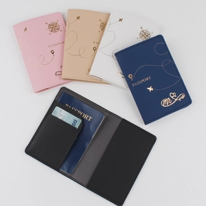 Flat lay of diverse PU leather passport covers showing internal card slots and colors