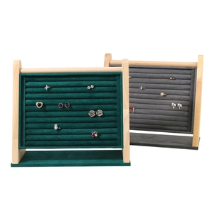 Wooden jewelry display stand with velvet lining for rings and earrings in green and grey