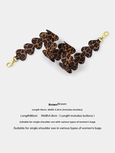 Detail of leopard print heart-shaped bag strap with gold hooks, size 86x4.8cm