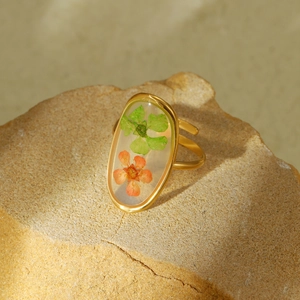 Elegant gold titanium steel ring with real dried flowers preserved in oval resin charm