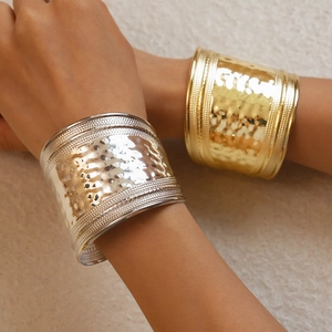 Wide hammered metal cuff bracelet with rope edges in gold and silver finish