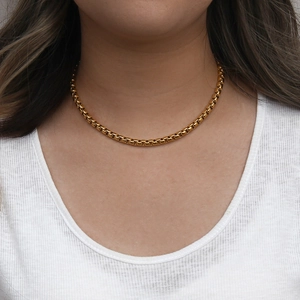 Close-up of elegant 18K gold plated stainless steel box chain necklace on a model