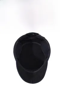 Detail view of winter flat cap showing the thick thermal lining and foldable ear flaps