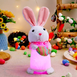 Illuminated white plush Easter bunny with pink LED glow and striped heart ornament
