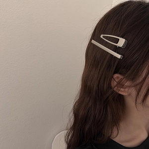 Minimalist silver metal hair clips in rectangular and hollow trapezoid styles for women