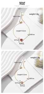 Detail of red and clear crystal heart pendants on gold plated stainless steel chains