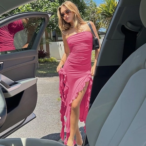 Detail of pink strapless bodycon dress with ruching, ruffles and side split