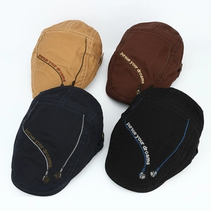 Detailed embroidery of headphones and pursue your dreams text on cotton beret caps