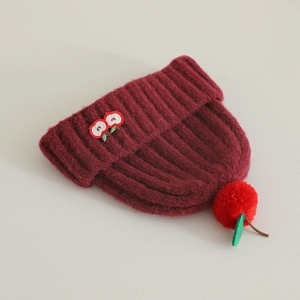 Winter knit cherry-style beanie for toddlers with thick ribbed texture and pom-pom
