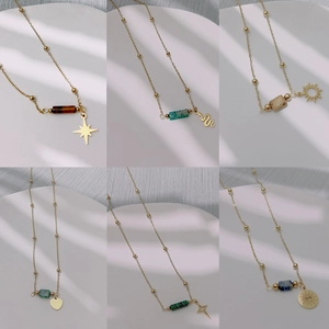 Gold-plated stainless steel necklaces featuring assorted natural stones and celestial charms