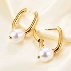 U-shaped gold stainless steel hoop earrings with white faux pearl pendants for women
