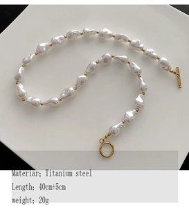 Macro shot of titanium steel irregular Baroque pearl necklace with OT toggle clasp and beads