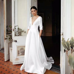 Elegant deep V-neck white satin wedding dress with mid-length sleeves and A-line skirt