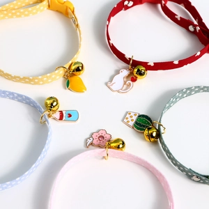 Flat lay of colorful pet collars with metal buckles and decorative alloy charms