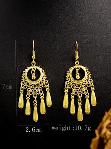 Detailed view of bohemian gold tassel earrings showing size 7cm and weight 10.7g