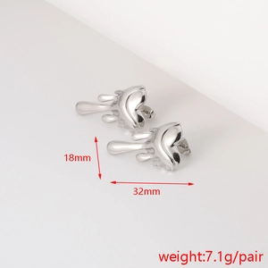 Detailed view of silver textured flower earrings with 32mm width and 18mm height dimension