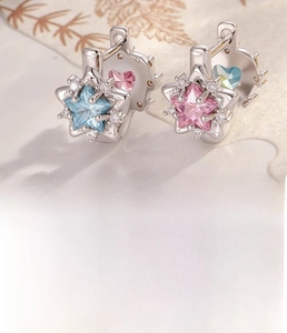 Close-up of star earrings with pink and blue zircons and 8mm inner diameter detail