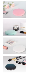 Close-up of portable LED makeup mirrors in pink green white and black colors
