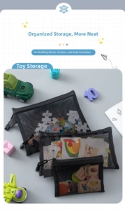 Close-up of three black mesh storage bags sorting puzzles and toys for organization