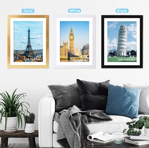 Three A3 PVC photo frames in gold, white and black colors hanging on a white living room wall
