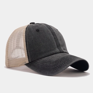 Detail view of charcoal washed cotton trucker hat with breathable khaki mesh and curved brim