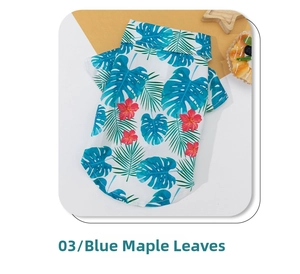 Detail of Hawaiian style dog shirt with tropical palm leaf and hibiscus flower print
