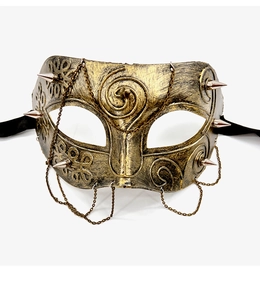 Macro detail of bronze steampunk masquerade mask featuring metallic spikes and chain accents