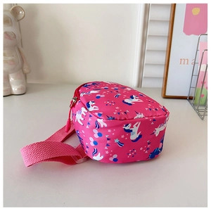 Detail of pink cartoon unicorn kids chest bag with adjustable strap on white background