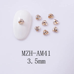 Close-up of 3.5mm champagne gold mini crystal clusters for DIY nail art decoration