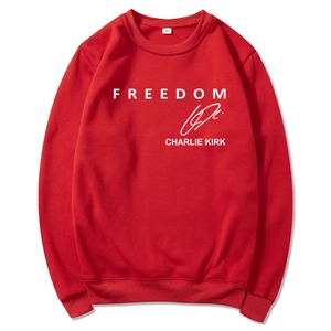 Detail of red Freedom hoodie showing Charlie Kirk signature and cotton fabric texture