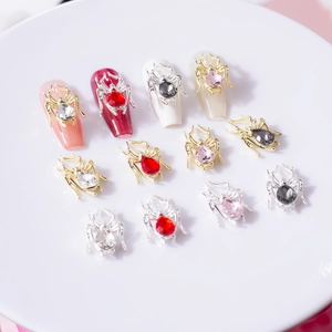 Macro shot of 3D spider alloy nail charms with pear-shaped rhinestones in various colors