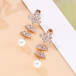 Detail showing rose gold tiered fan frames with micro-pave crystals and pearl drop