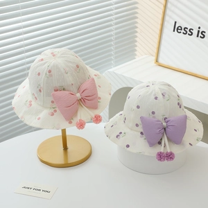 Baby girl summer sun hat with sweet fruit print and a large bow in pink and purple colors