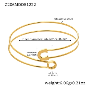 Detail view of gold-plated safety pin bangle with 6.06g weight and 6.0cm diameter specs