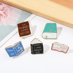 Detailed set of 5 colorful enamel book pins with creative letterings for bags and clothes