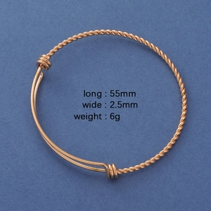 Detailed view of rose gold twisted bangle with 55mm length and 2.5mm width specs