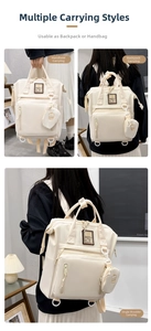 Three-way carry mummy bag in cream white showing handbag, backpack, and shoulder styles