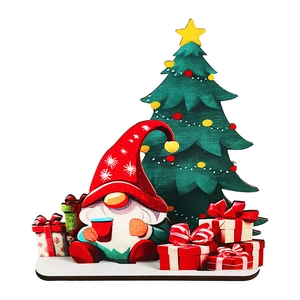 Detail of wooden Christmas gnome tabletop standee with festive tree and gift boxes