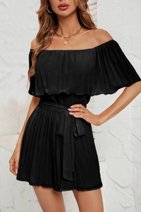 Detail of elegant black off-shoulder pleated romper with a matching waist tie belt