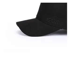 Close-up of black winter cap with SPORT embroidery and thick reinforced brim