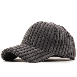 Detailed view of the dark grey corduroy fabric and stitching on a winter baseball cap