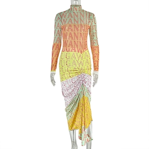 Close-up of slim-fit dress with colorful letter print and asymmetric draped hemline detail
